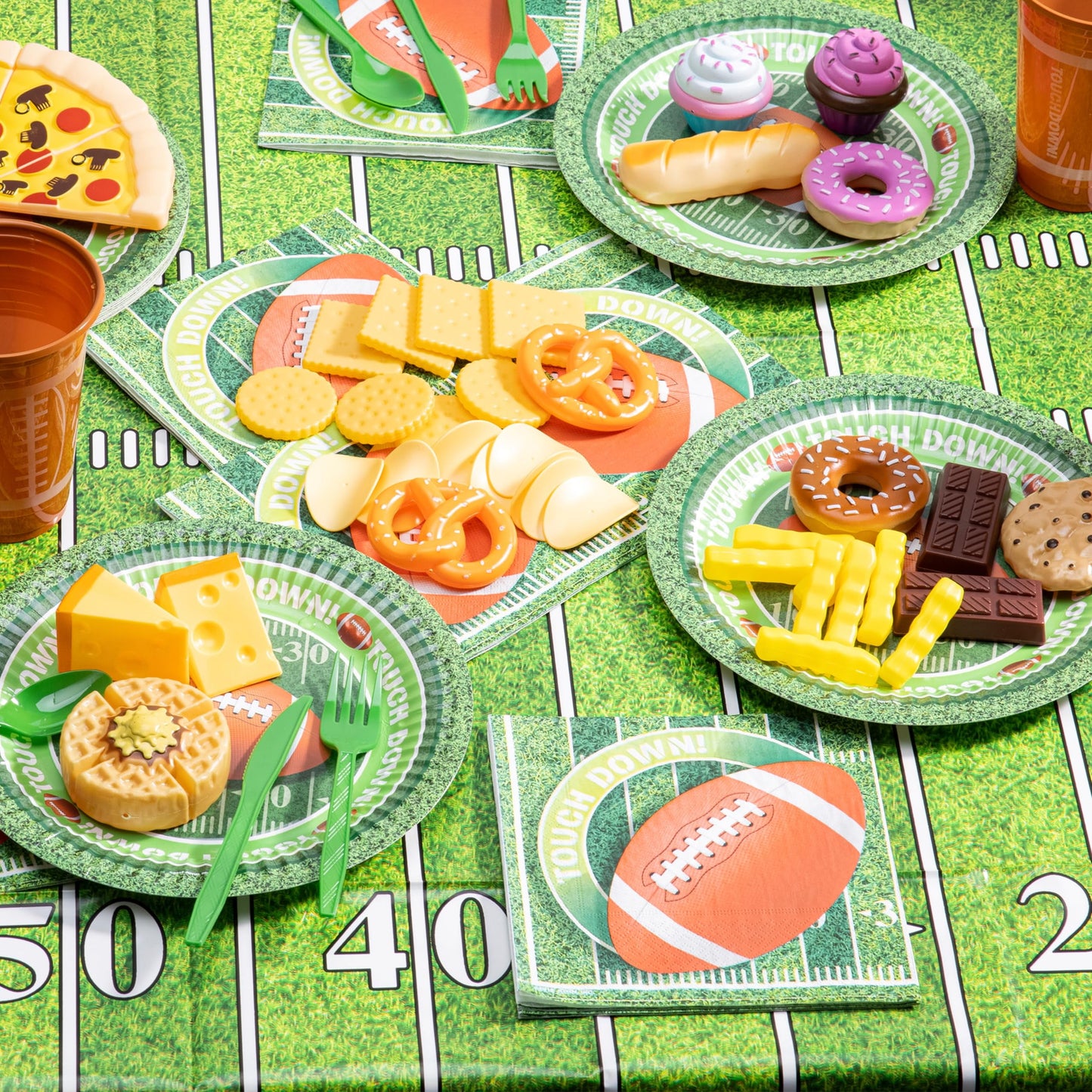 74 football match day party supplies packages -18 football themed cups, 18 plates, 36 napkins,