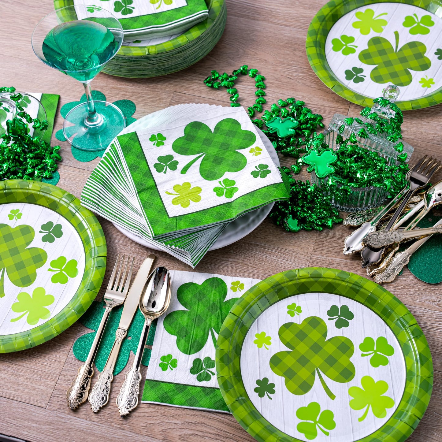 A set of 100 St. Patrick's Day plates and napkins, accommodating 50 pieces. 50 green clover checkered plates and 50 green clover checkered paper napkins, designed with clover