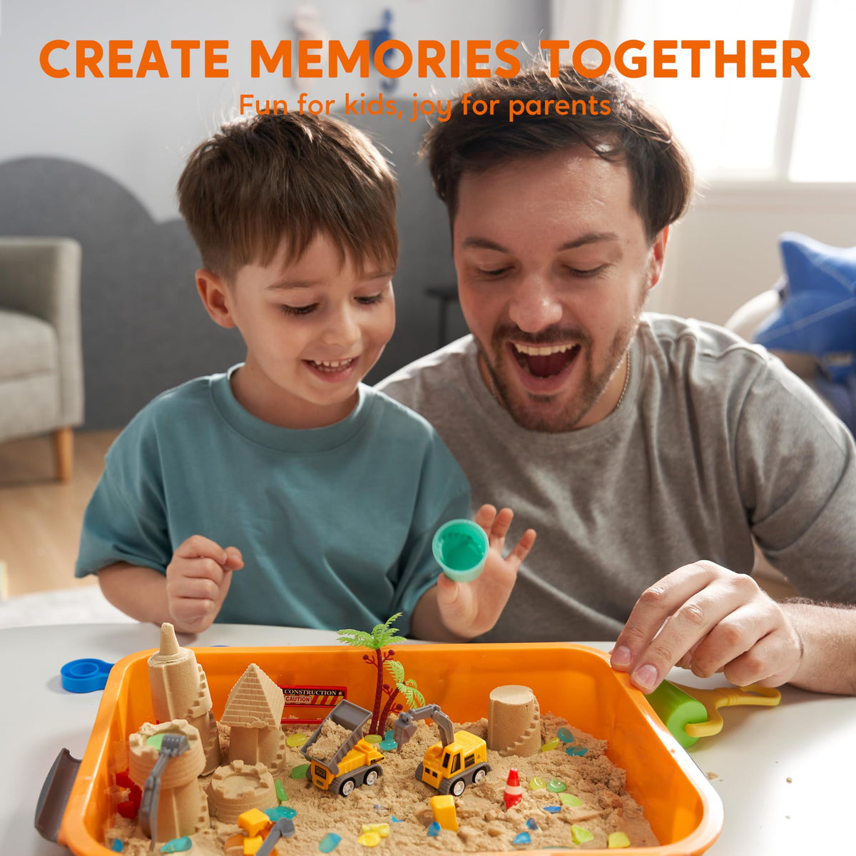 Parent and child playing together with construction sensory bin